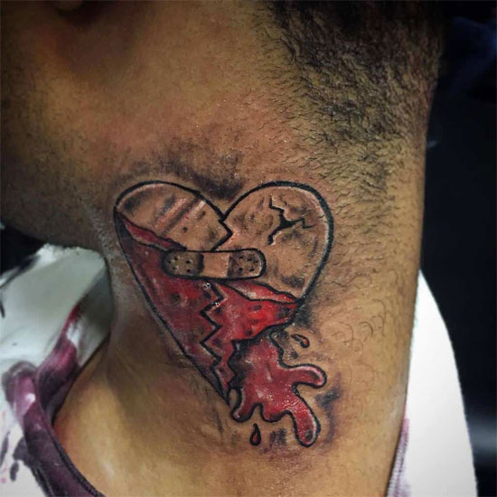 Bleeding heart tattoo on neck