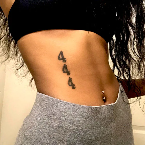 444 tattoo on side belly 1