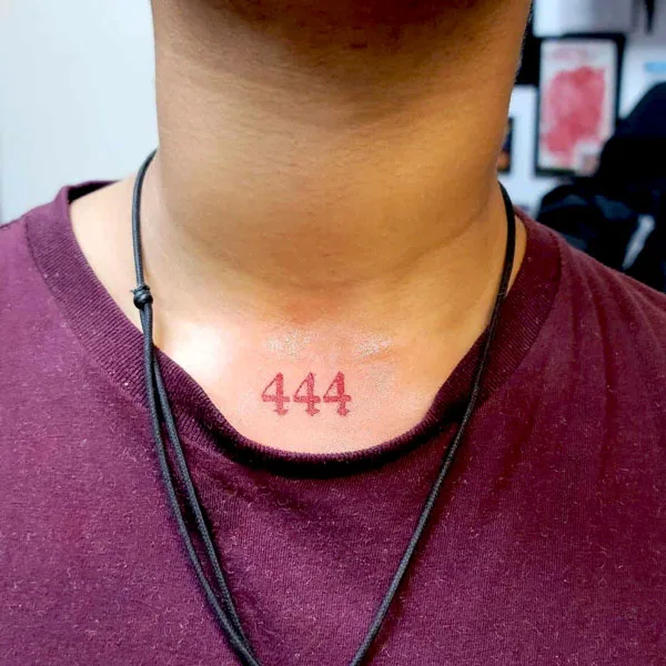 444 tattoo on under throat 2