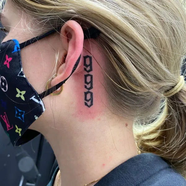 999 tattoo behind ear 1