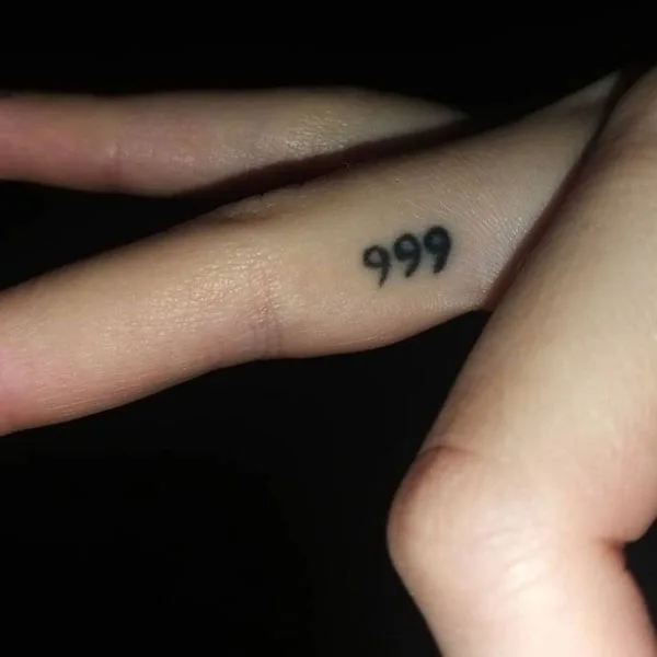 999 tattoo on finger 2