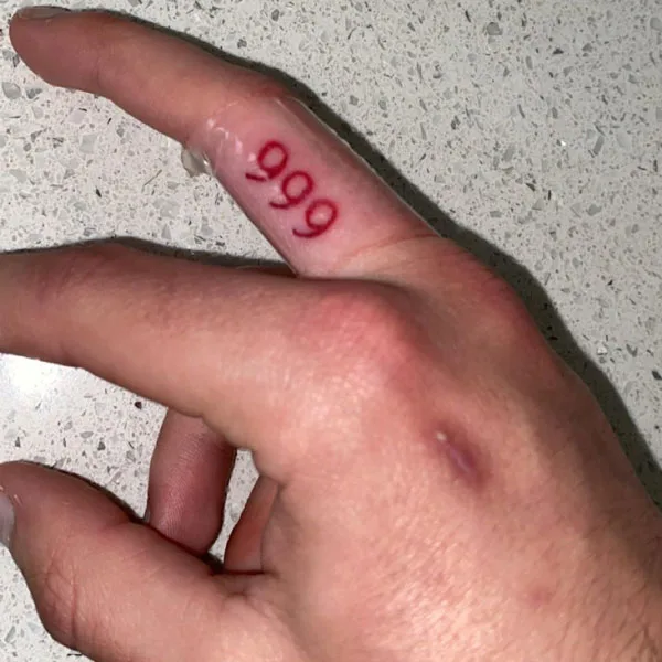 999 tattoo on finger 3