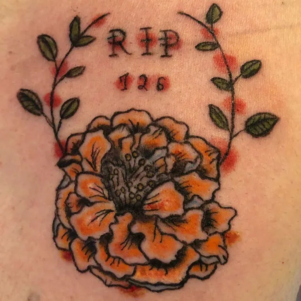Marigold rip tattoo