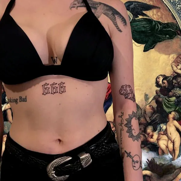666 tattoo on lower chest