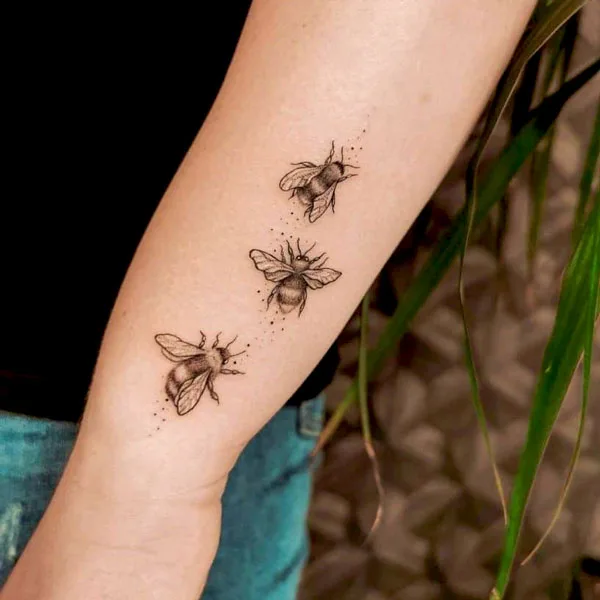 Bee forearm tattoo