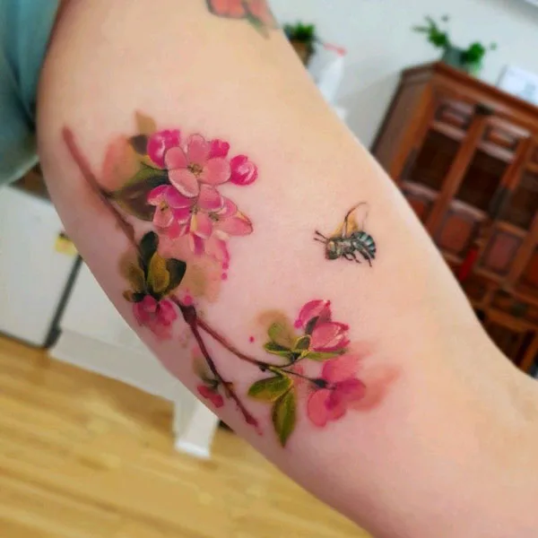 Cherry blossom and bee tattoo