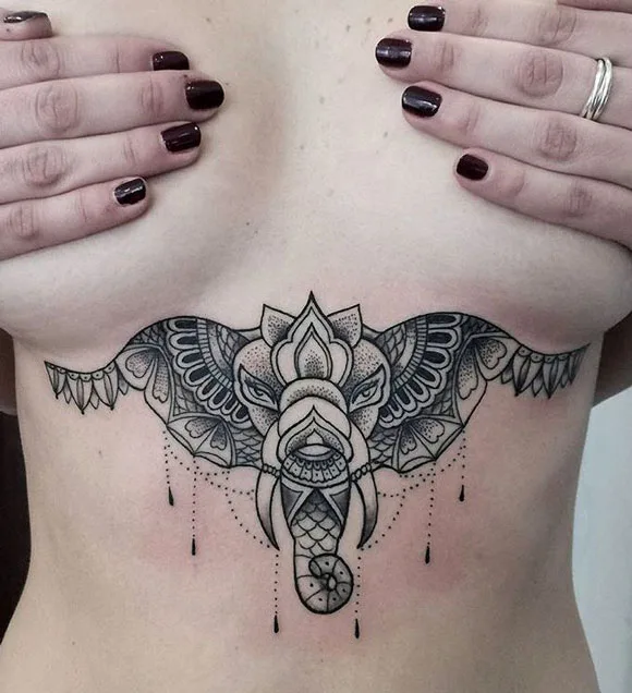 Elephant tattoo under breast