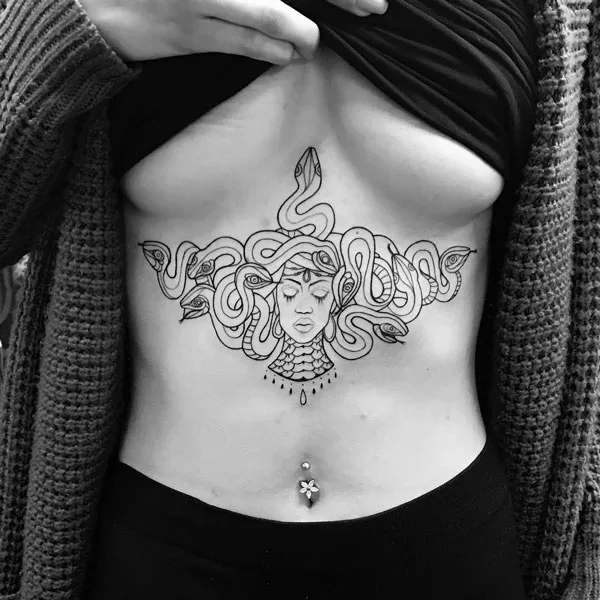 Medusa under breast tattoo