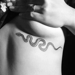 Snake tattoo under breast 1