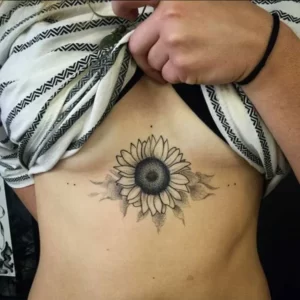 Sunflower tattoo under breast 1