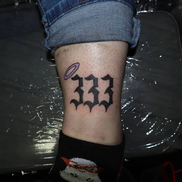 333 tattoo on leg