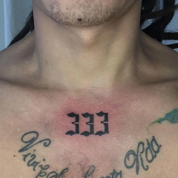 333 tattoo on upper chest