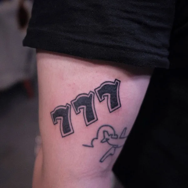 777 tattoo 66