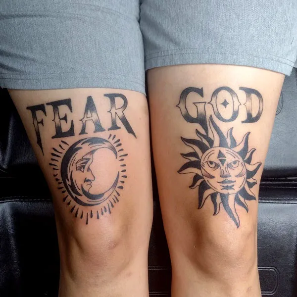 Above knee fear god tattoo