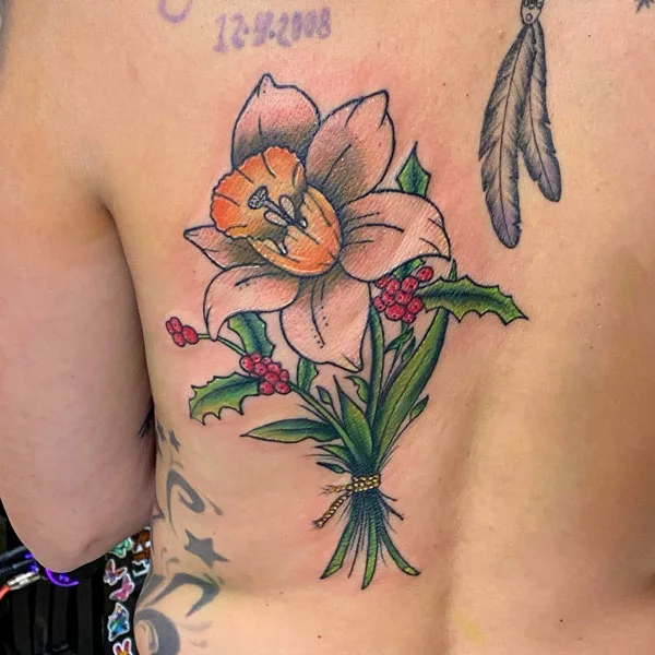 December birth flower tattoo on back