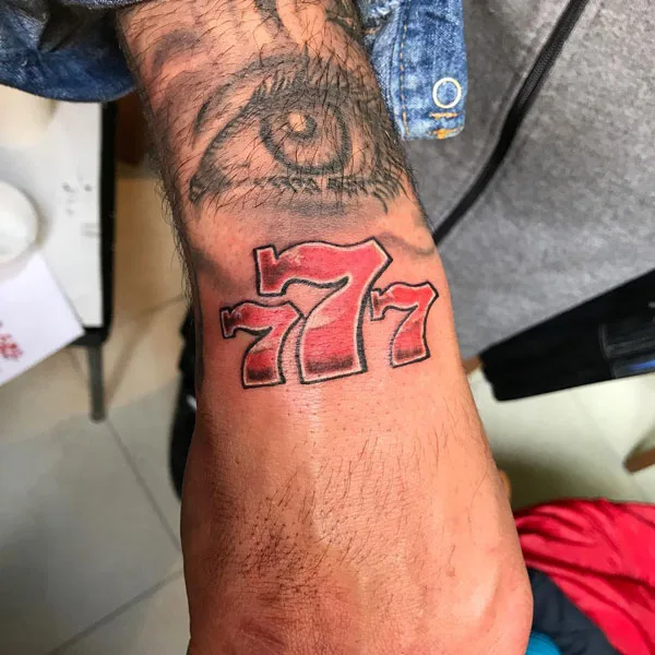 Eye 777 tattoo