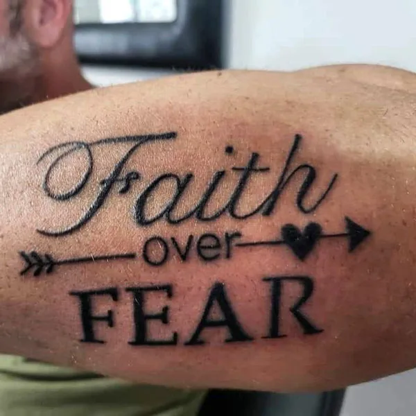 Faith over fear tattoo with arrow