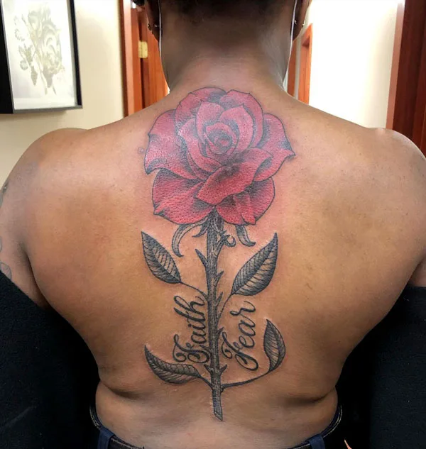 Faith over fear tattoo with flower