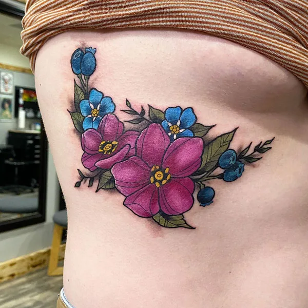 Flower side boob tattoo