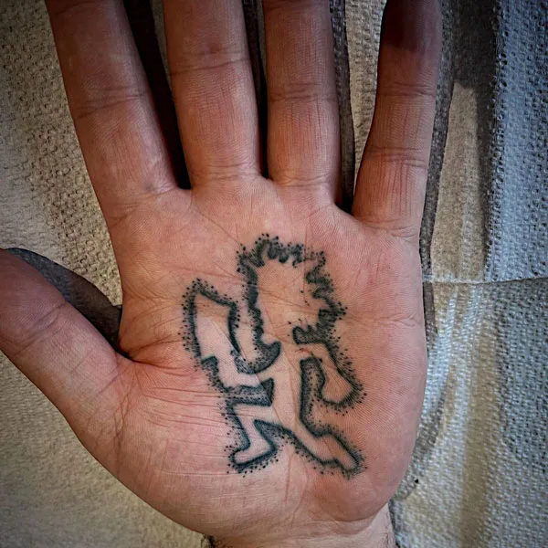Hatchet man tattoo on hand