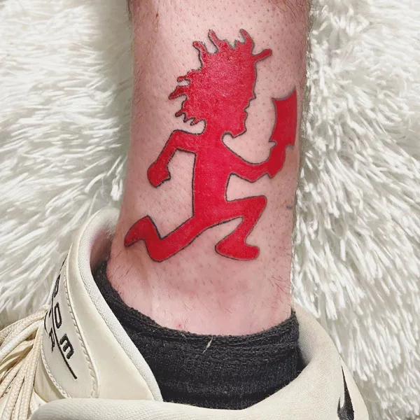 Hatchet man tattoo on leg