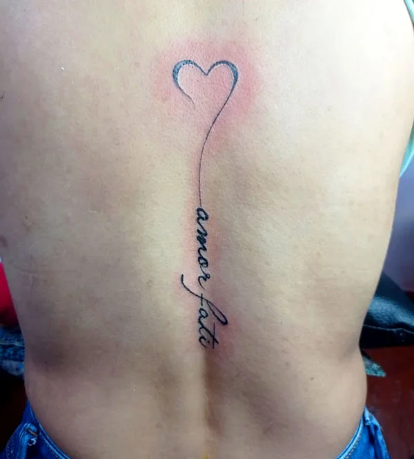 Spine amor fati tattoo