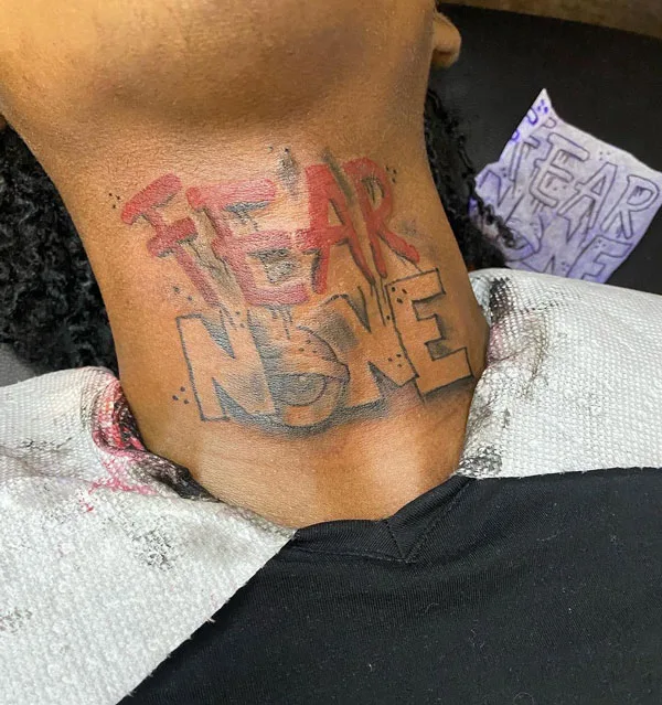 Throat fear none tattoo