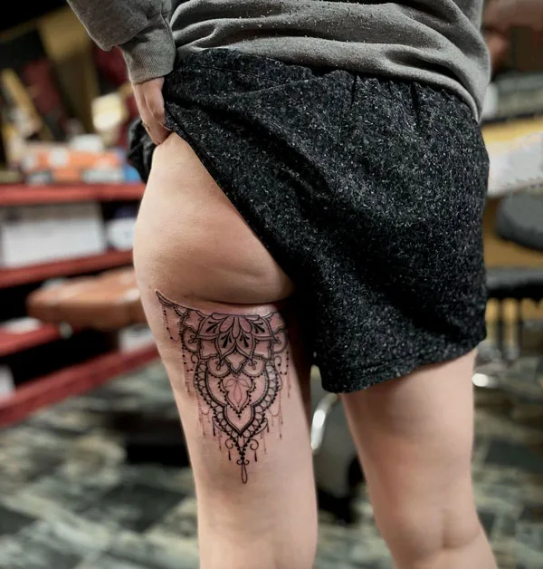 Under butt tattoo