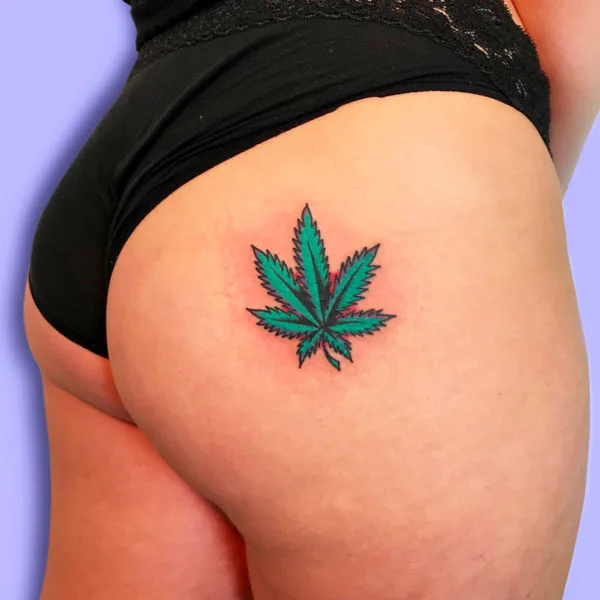 Weed leaf butt tattoo
