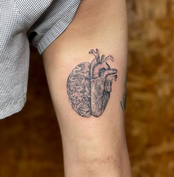 Anatomical heart and brain tattoo