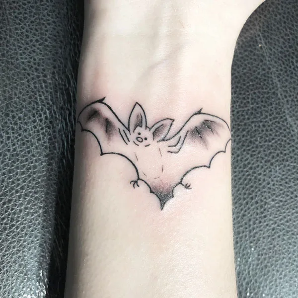 Bat outline tattoo