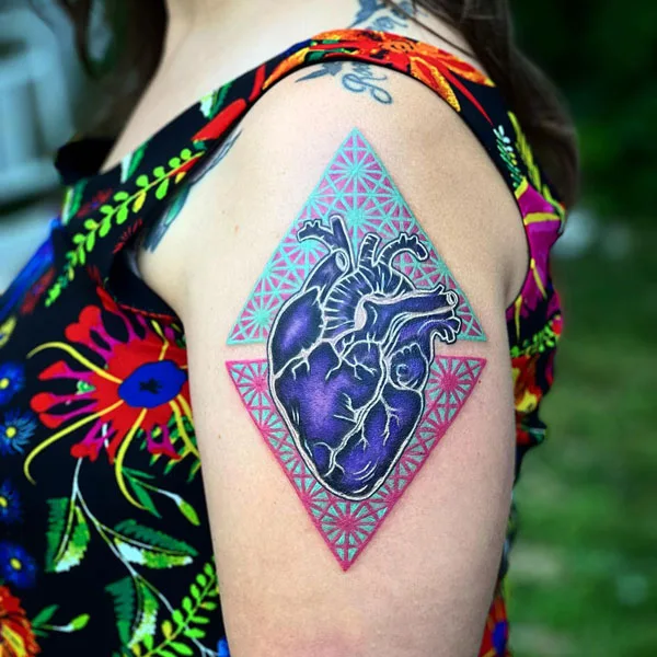 Black anatomical heart tattoo