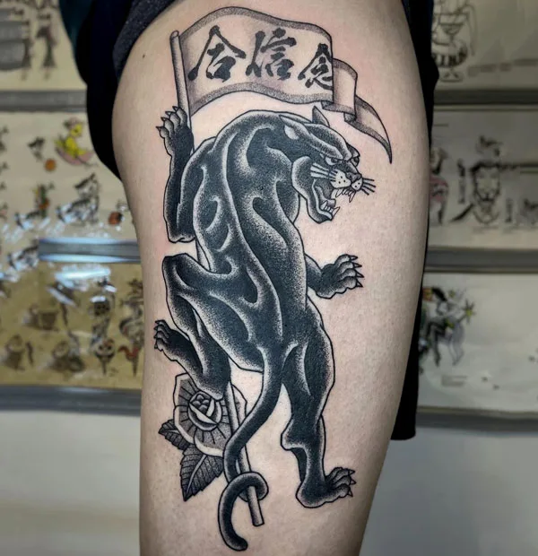 Black panther thigh tattoo