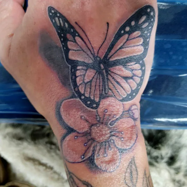 Butterfly hand tattoo 27
