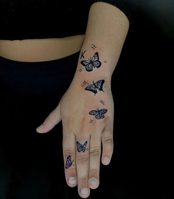 Butterfly hand tattoo 29