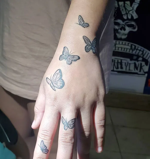 Butterfly hand tattoo 32