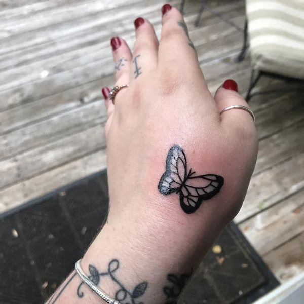 Butterfly hand tattoo 34