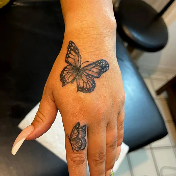 Butterfly hand tattoo 4
