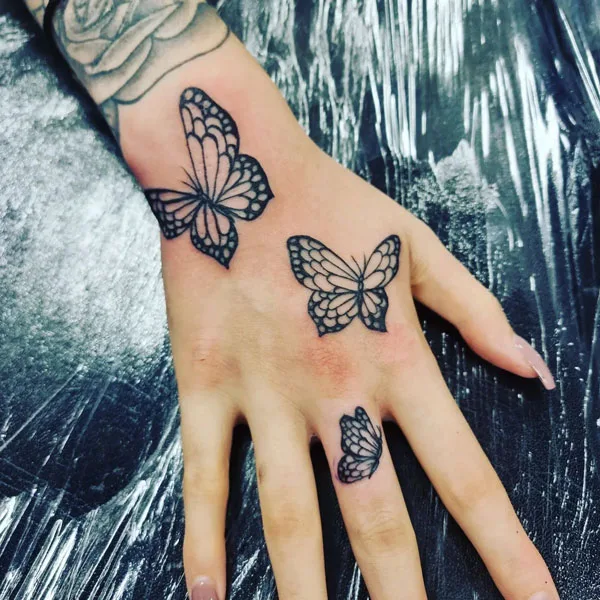 Butterfly hand tattoo 40