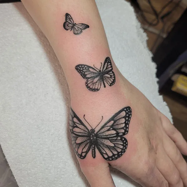 Butterfly hand tattoo 42