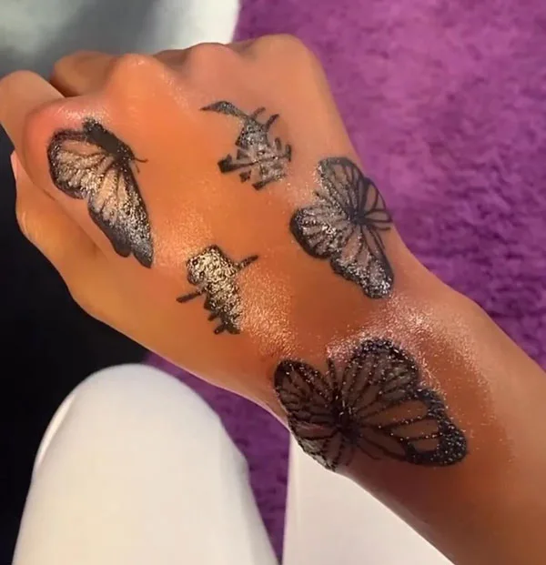 Butterfly hand tattoo 43