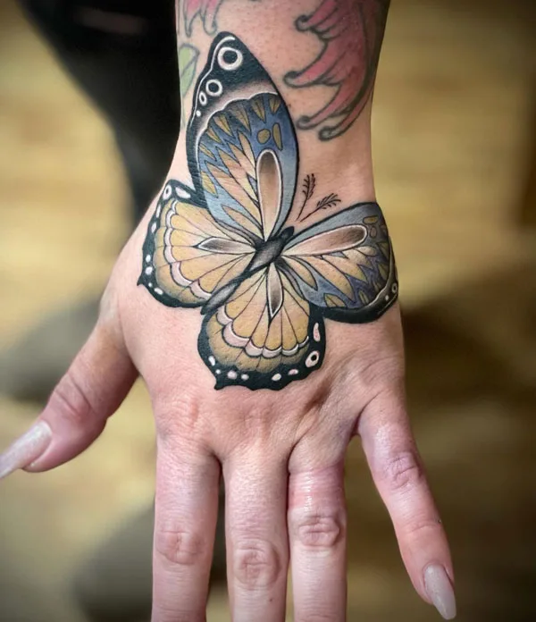 Butterfly hand tattoo 48
