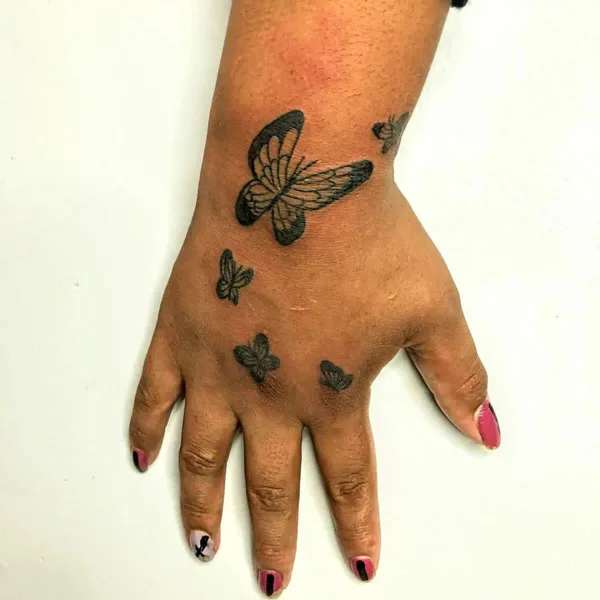 Butterfly hand tattoo 50
