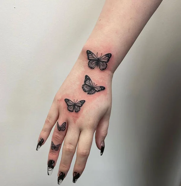 Butterfly hand tattoo 52