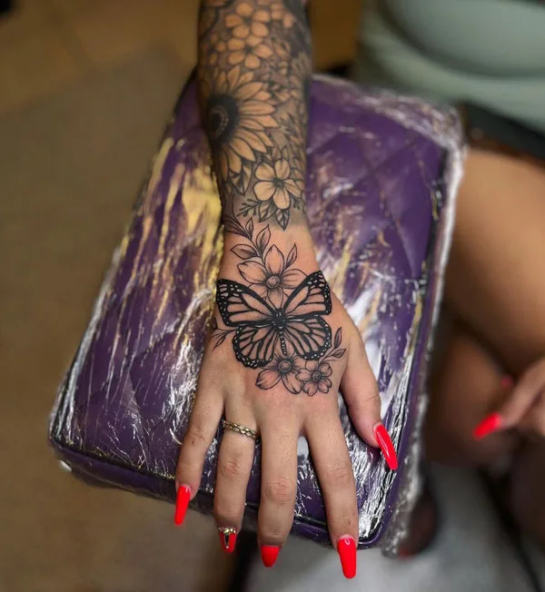 Butterfly hand tattoo 54