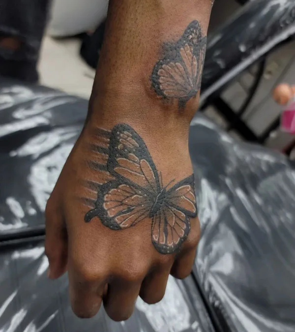 Butterfly hand tattoo 59