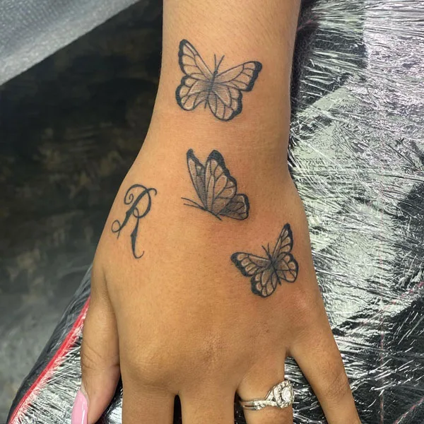 Butterfly hand tattoo 63