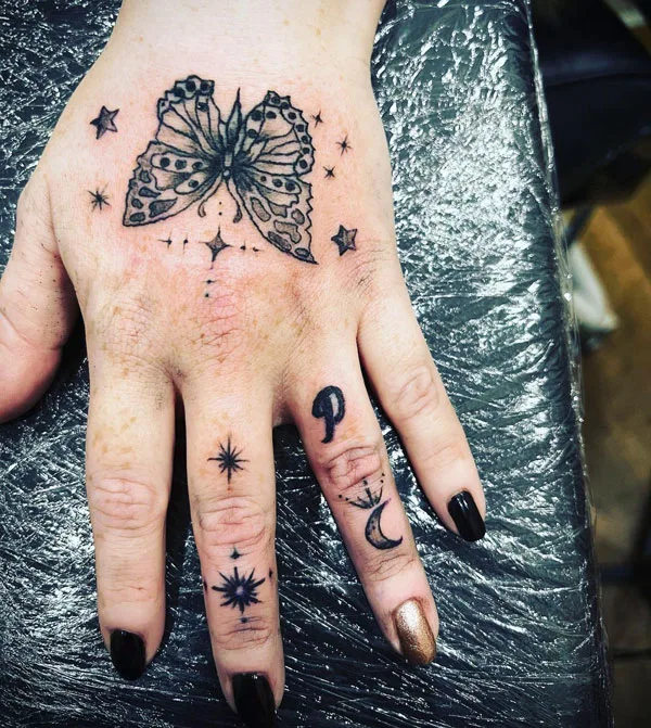 Butterfly hand tattoo 7