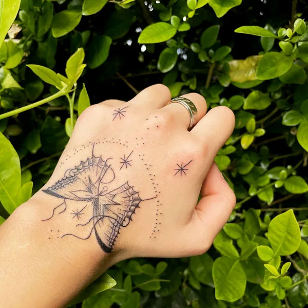 Butterfly hand tattoo 9