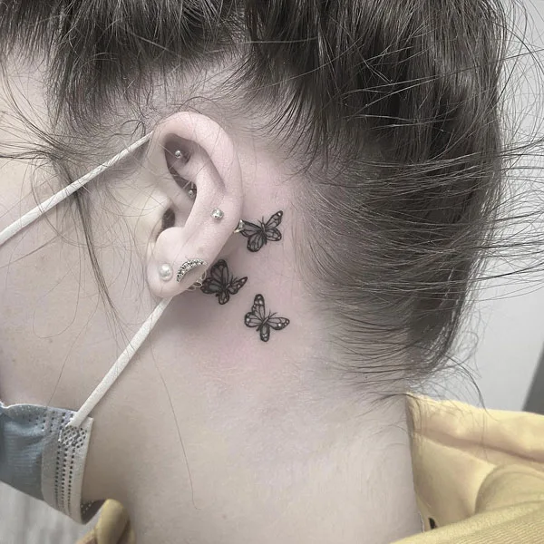 Butterfly tattoo behind ear 34